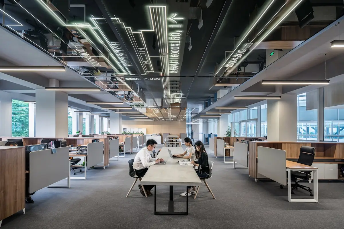 The open-plan office floor, with long shared desks